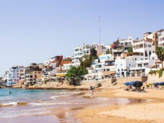 white building near sea during daytime