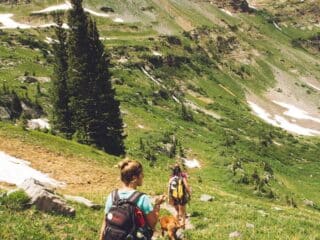 woman walking down the hill at daytime