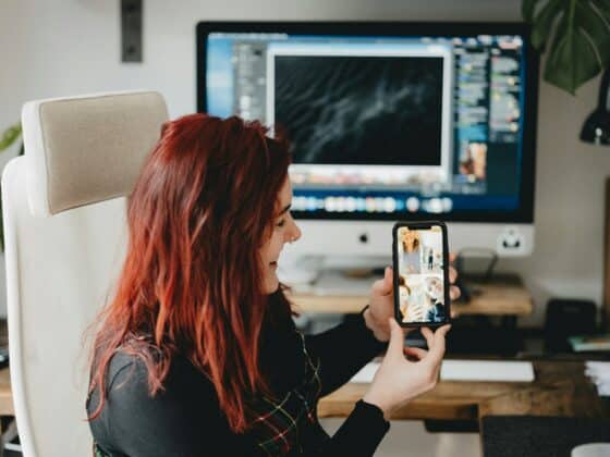 woman in black long sleeve shirt holding iphone 6