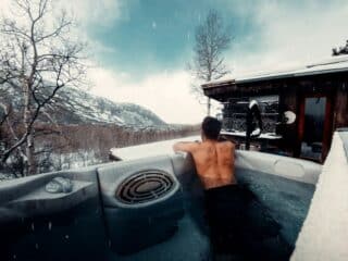 Hot Tub in Winter: Is It Safe in Freezing Temperatures? woman in swimming pool during daytime